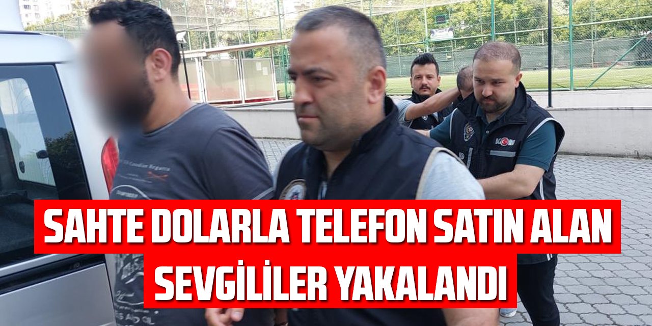 Sahte dolarla telefon satın alan sevgililer yakalandı