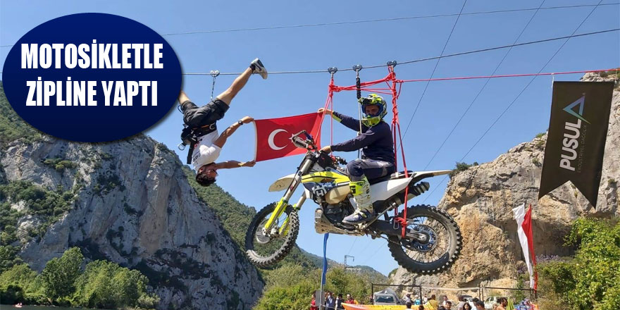 Motosikletle zipline yaptı