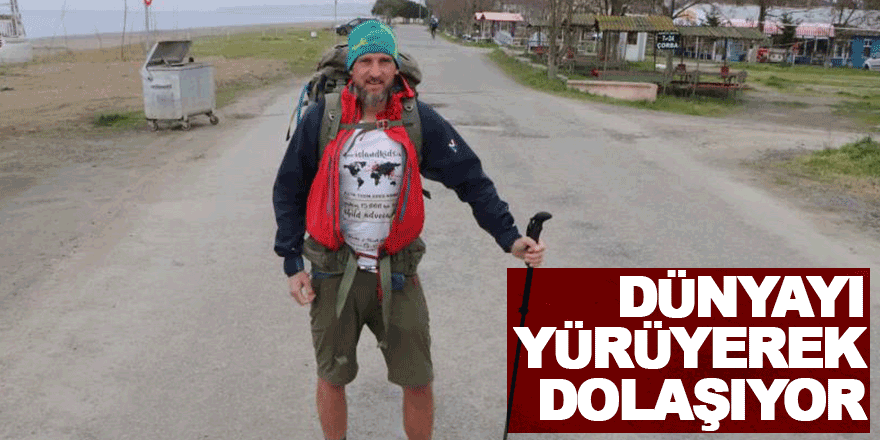 dünyayı yürüyerek dolaşıyor  